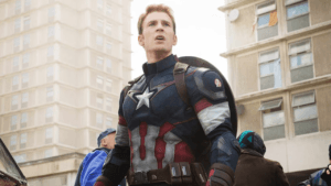 Chris Evans as Steve Rogers wearing the Captain America suit, standing alert in an urban setting during Avengers: Doomsday teaser scene.