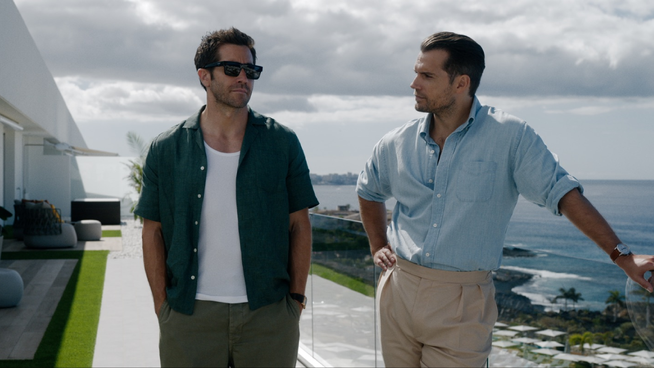 Jake Gyllenhaal and Henry Cavill. in a still of In the Grey Review Roundup: Critics are split over Guy Ritchie’s slick but overloaded action caper.